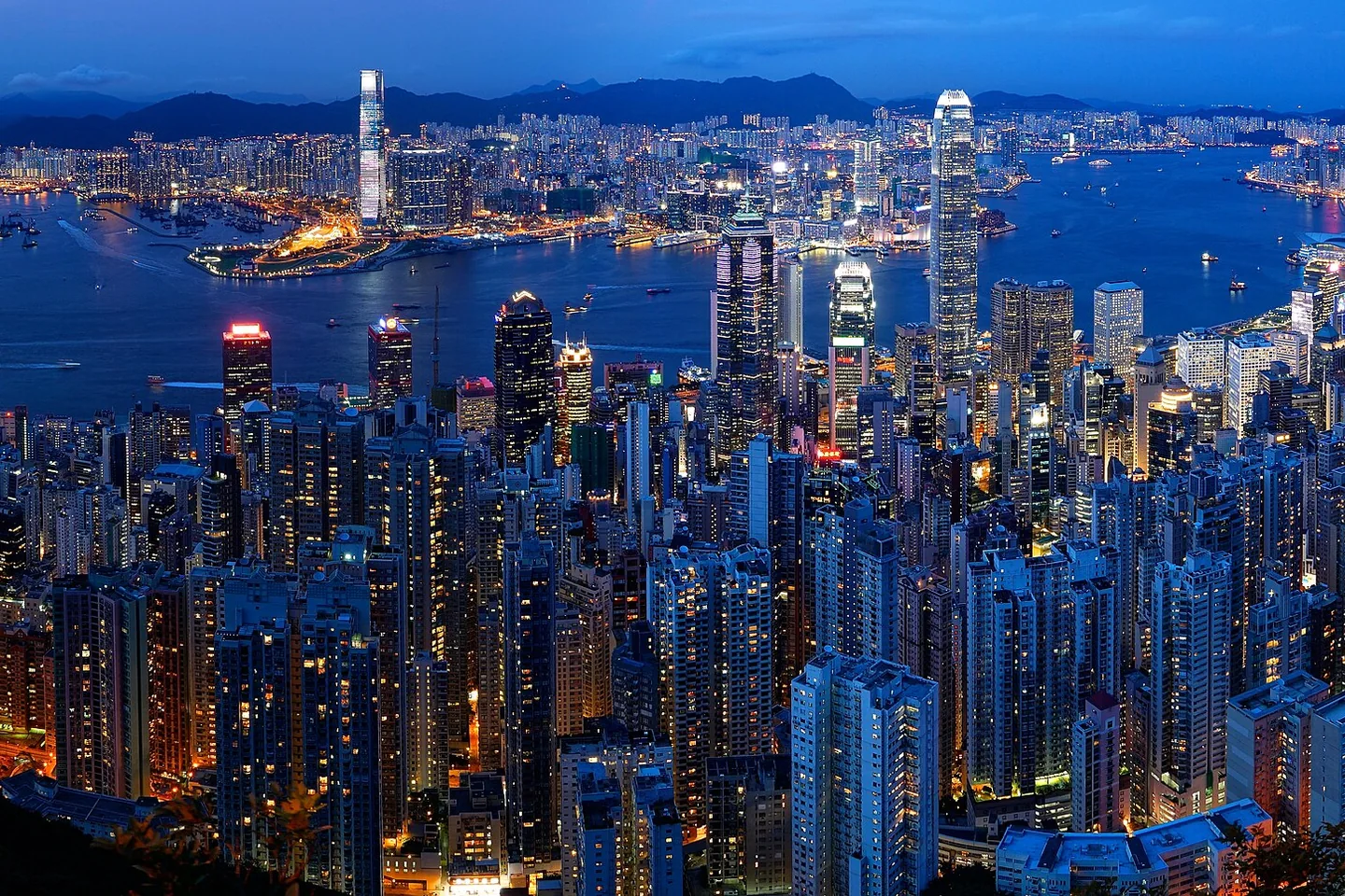 Hong Kong’s illuminated skyline and Victoria Harbour at dusk, viewed from Victoria Peak.